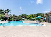Thumbnail 13 of 22 - A large swimming pool with a blue logo in the middle.