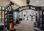 Thumbnail 29 of 44 - A Gym With Weights at Odyssey Apartments, Albuquerque, New Mexico