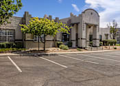 Thumbnail 43 of 44 - A Building With a Parking Lot at Odyssey Apartments, New Mexico, 87114