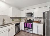 Thumbnail 9 of 32 - Spacious Kitchen with Stainless Steel Appliances at Orion Arlington Lakes, Arlington Heights, IL