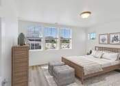 Thumbnail 45 of 51 - a bedroom with a bed and three windows