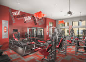 Thumbnail 12 of 21 - 24 hour fitness center with cardio equipment and weights