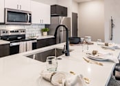 Thumbnail 2 of 16 - Kitchen area at Velo Village Apartments, Franklin, Wisconsin