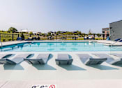 Thumbnail 15 of 16 - Pool area at Velo Village Apartments, Franklin, Wisconsin