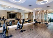 Thumbnail 40 of 82 - Fitness center with tablet-integrated cardio machines at Vora Mission Valley, California