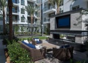 Thumbnail 23 of 82 - Open-air Loggia with large screen TV's and cozy seating area at Vora Mission Valley, San Diego, CA, 92120