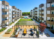 Thumbnail 1 of 26 - Outdoor space with community grill and pool