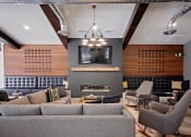 Thumbnail 27 of 35 - Cluhouse lounge seating, fireplace and wall tv