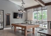 Thumbnail 30 of 35 - Clubhouse pool table, bar seating and wall tv from a different angle