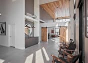 Thumbnail 19 of 35 - Recreation room with tables and lounge seating areas