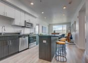 Thumbnail 14 of 35 - Model apartment home kitchen/island from a different angle