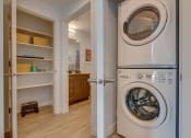 Thumbnail 15 of 35 - Front load washer/dryer in laundry area and closet