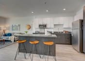 Thumbnail 1 of 35 - Model apartment home kitchen/island and living room