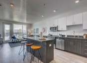 Thumbnail 3 of 35 - Model apartment home kitchen/island and living room