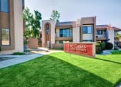 Thumbnail 4 of 26 - The Casas Luxury Rentals sign is in front of a building at The Casas Apartments, San Diego, CA