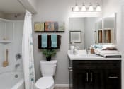 Thumbnail 17 of 26 - A bathroom with a white toilet, a white sink, and a white bathtub at The Casas Apartments, San Diego, CA, 92126