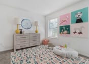 Thumbnail 11 of 23 - a bedroom with a dresser and a window