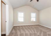 Thumbnail 45 of 60 - a bedroom with two windows and a ceiling fan