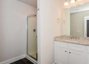 Thumbnail 51 of 60 - a bathroom with a sink and a shower