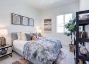 Thumbnail 42 of 47 - a bedroom with a bed and a window