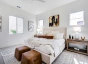 Thumbnail 41 of 47 - a bedroom with a bed and two windows