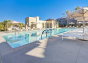 Thumbnail 5 of 47 - a swimming pool at a resort with chairs and umbrellas