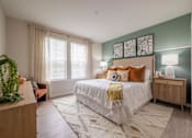 Thumbnail 5 of 31 - a bedroom with a bed and two windows