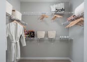 Thumbnail 6 of 45 - Walk-in closet with drying rack and towels at Alta Davis, Durham, NC