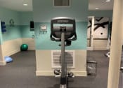 Thumbnail 22 of 32 - a workout room in a gym with a treadmill