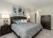 Thumbnail 27 of 32 - a bedroom with a bed and two dressers