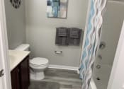 Thumbnail 32 of 32 - a bathroom with a shower and a toilet and a sink