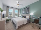 Thumbnail 7 of 38 - a bedroom with green walls and a white bed