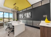 Thumbnail 25 of 38 - a conference room with a yellow ceiling and a desk with chairs