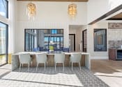 Thumbnail 18 of 38 - a dining room with a long table and chairs