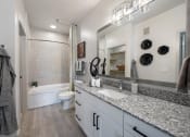 Thumbnail 12 of 38 - a bathroom with a sink and a toilet