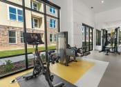 Thumbnail 32 of 38 - the residence apartments fitness room with exercise equipment