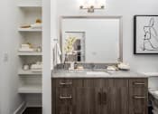 Thumbnail 17 of 41 - a bathroom with a sink and a mirror