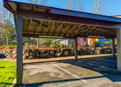 Thumbnail 11 of 44 - a parking garage with a roof over a parking lot