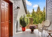 Thumbnail 18 of 44 - front porch with chairs and plants and a door