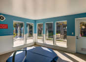 Thumbnail 20 of 44 - a dining room with windows and a table