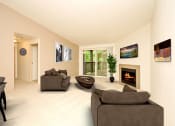 Thumbnail 21 of 44 - a living room with couches and a table and a fireplace