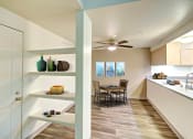 Thumbnail 27 of 44 - a dining room and kitchen with a table and a ceiling fan