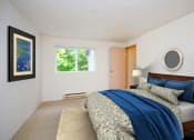 Thumbnail 37 of 44 - a bedroom with a bed and a window