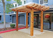 Thumbnail 20 of 28 - a patio with awning in front of a building