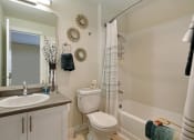 Thumbnail 30 of 30 - a bathroom with a sink toilet and a shower