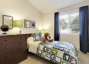 Thumbnail 26 of 30 - a bedroom with a bed with a teddy bear on it