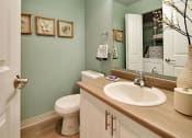Thumbnail 28 of 30 - a bathroom with a sink toilet and a mirror