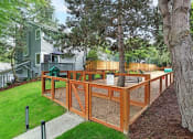 Thumbnail 9 of 30 - a large backyard with a deck and a tree