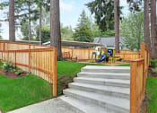 Thumbnail 3 of 30 - a wooden fence with stairs and a playground in a yard