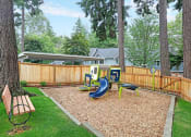Thumbnail 14 of 30 - the backyard has a playground with slides and a swing set